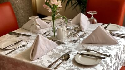 Arranged square table with cutlery at Pegasus Hotel Guyana