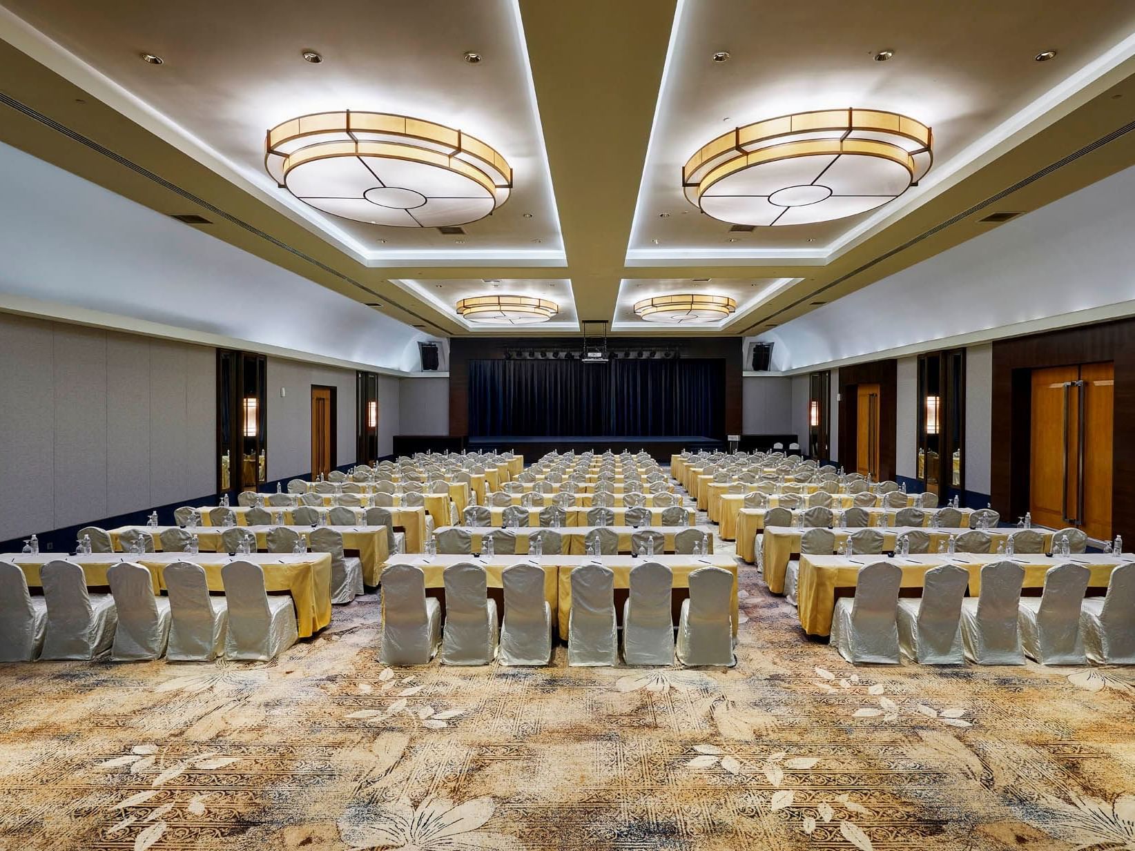 Chair arrangement in spacious Saujana Ballroom with carpeted floors at Saujana Hotel Kuala Lumpur