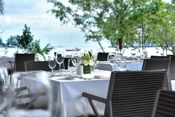 Dining area arranged outdoor with a sea view at The Danna Langkawi