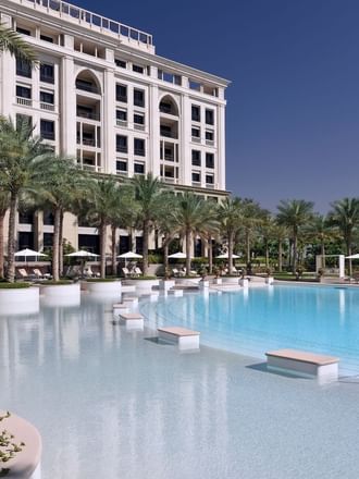 Palm trees & pool benches by the East pool at Palazzo Versace 