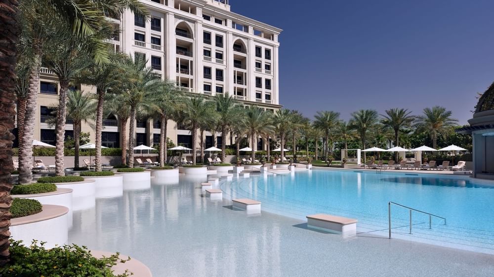 Palm trees & pool benches by the East pool at Palazzo Versace 
