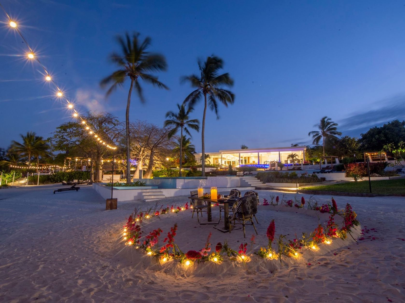 Candles lighted on beach near SafiraBlu Luxury Resort & Villas