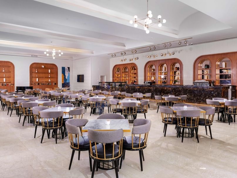 Elegant dining room with tables and chairs in Pickalbatros Laguna Vista Hotel in South Sinai Governorate.
