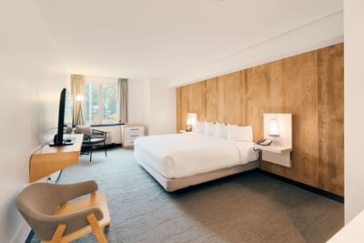 King bed, TV & loungers in Deluxe King at Aava Whistler Hotel