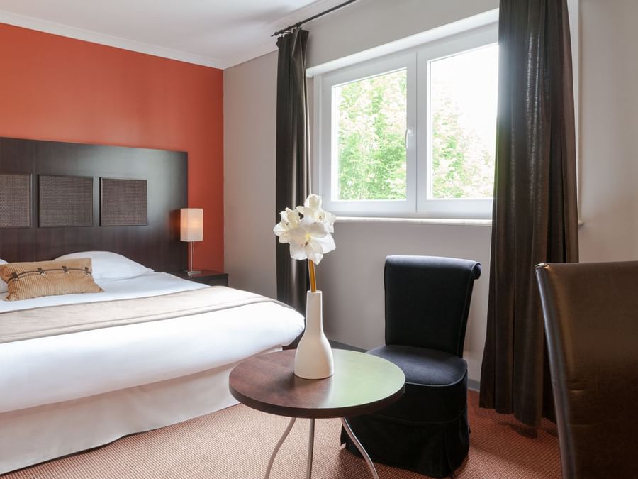 Privilege double bedroom with king bed at The Originals Hotels
