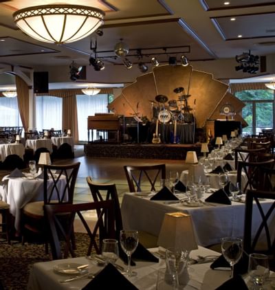 Restaurant seating and small stage.