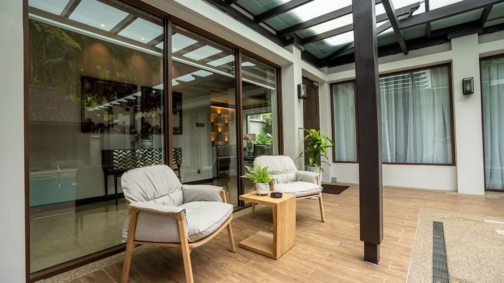 Private terrace with modern seating and glass doors in the Royal Villa at The Banjaran Hotsprings Retreat, Ipoh