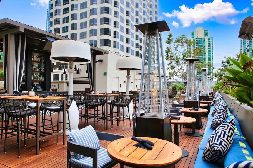 Torch Heaters by the tables in Topside Terrace Kitchen & Bar at Hotel Republic San Diego