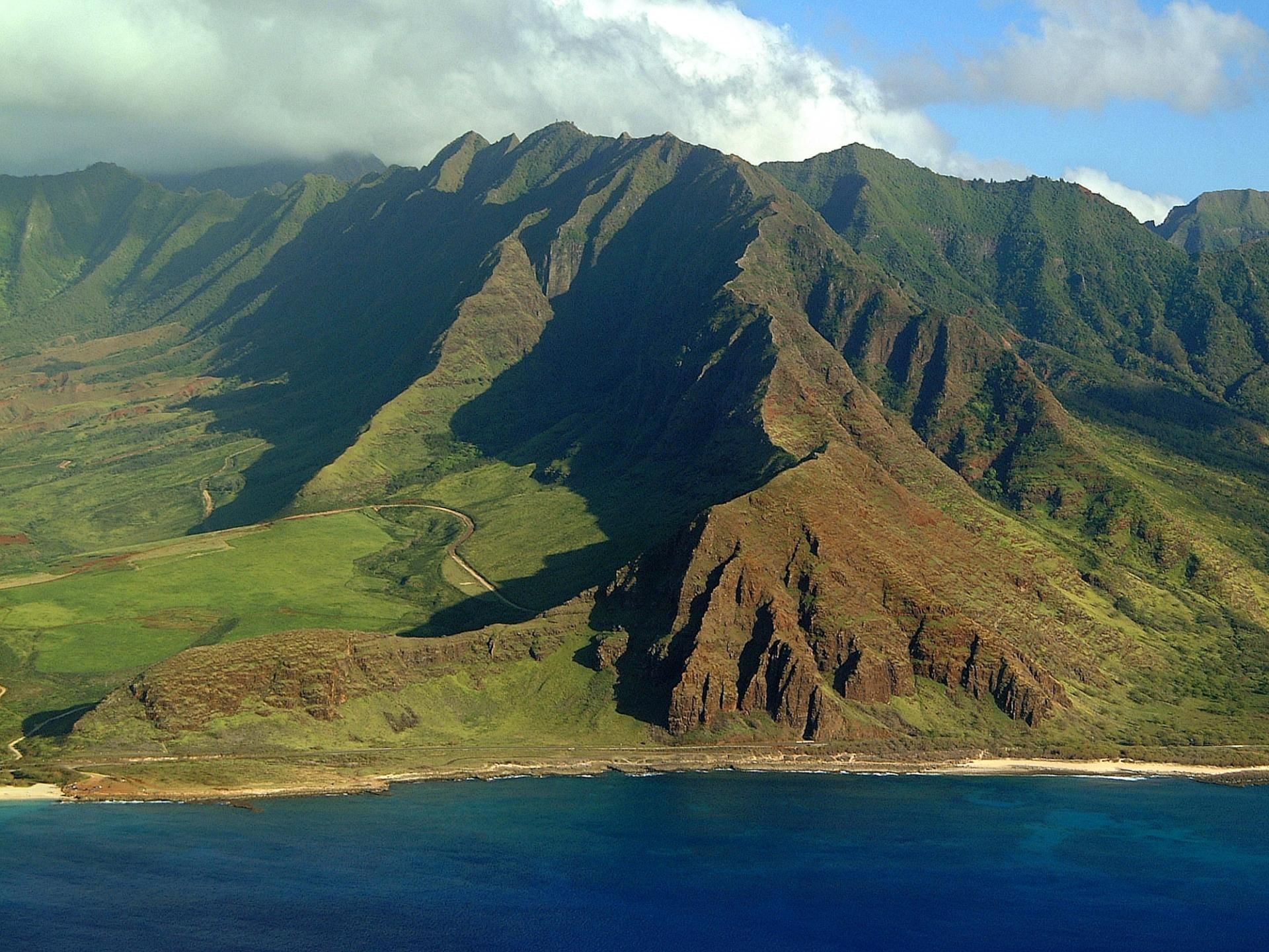 Aerial view of Leeward Coast & the mountain ranges near Waikiki Resort Hotel by Sono