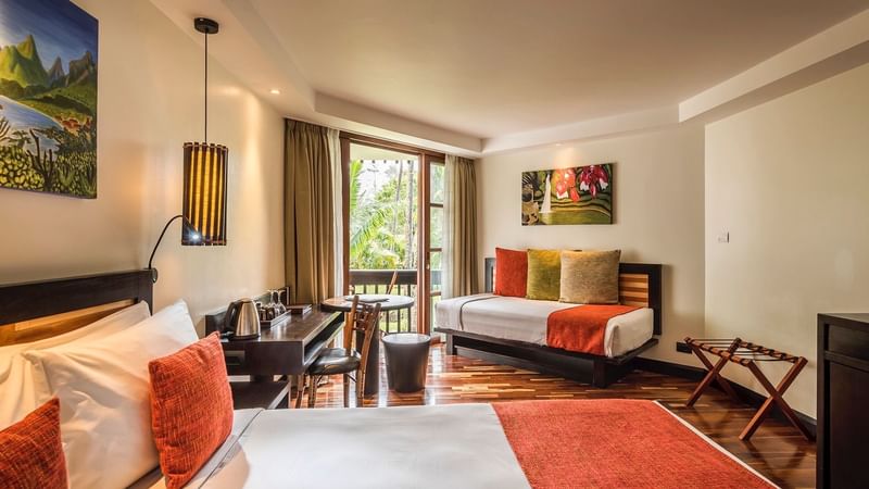 Bed & furniture in Superior Garden View room at Warwick Fiji