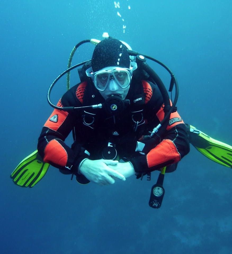 Scuba diver exploring underwater near Ananea Madivaru Maldives