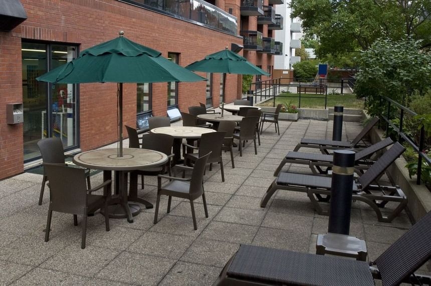 Outdoor dining & lounge area at Cartier Place Suite Hotel