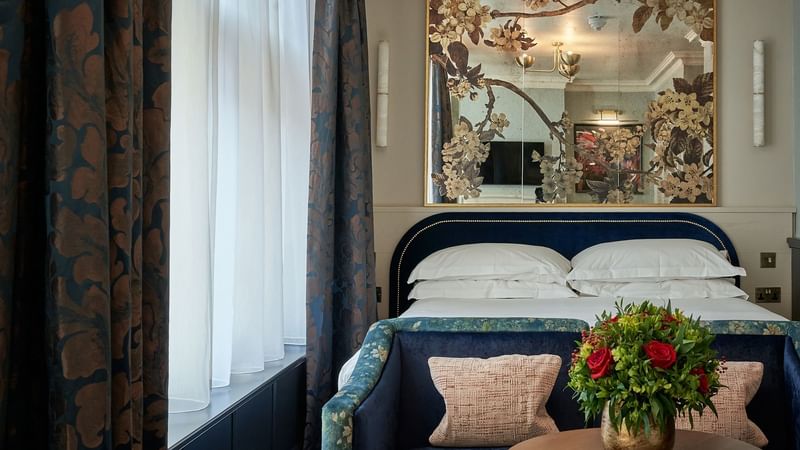 Comfy furniture & artistic architecture in Deluxe Room at The Capital Hotel London