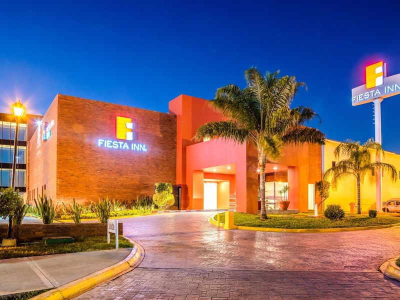Exterior view of Fiesta Inn Monterrey La Fe at night