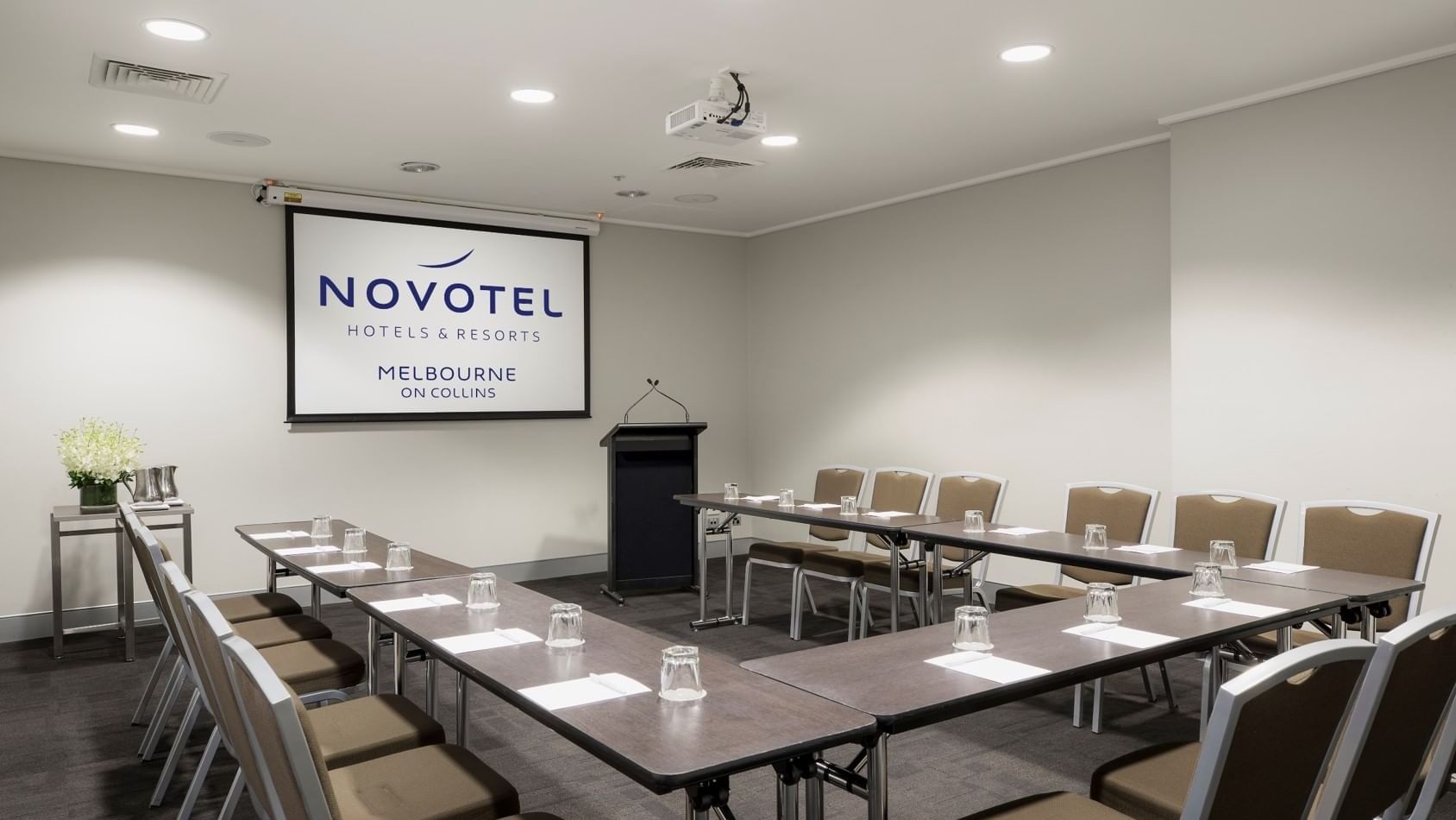 U-shaped table setup for event at Novotel Melbourne on Collins