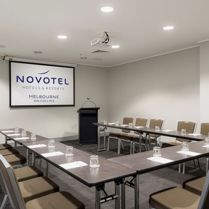 U-shaped table setup for event at Novotel Melbourne on Collins