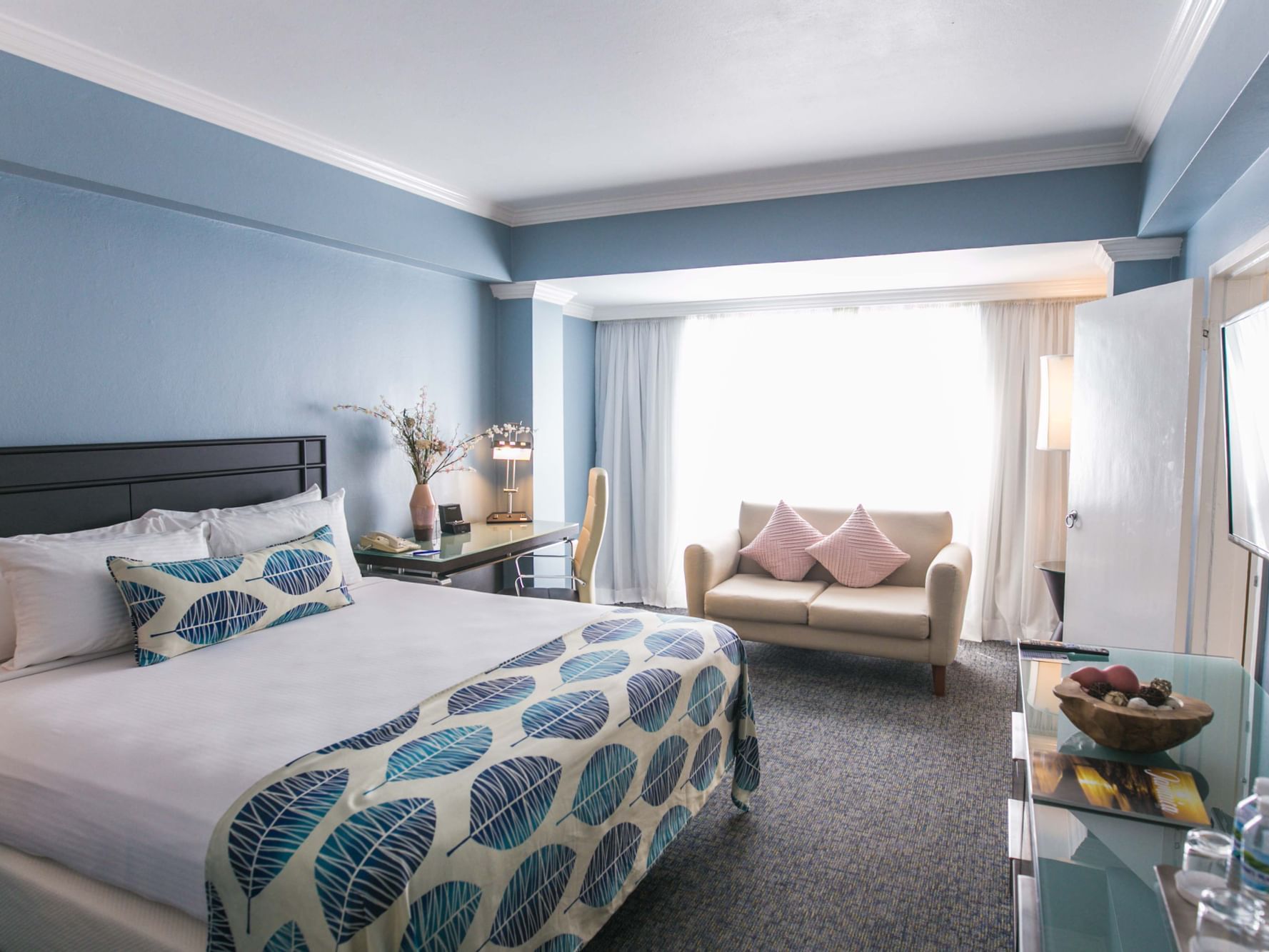 Deluxe One Bedroom Suite bed & sofa at Jamaica Pegasus Hotel