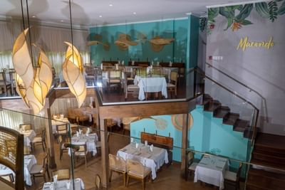 Interior of the dining area with yellow light at Fiesta Resort