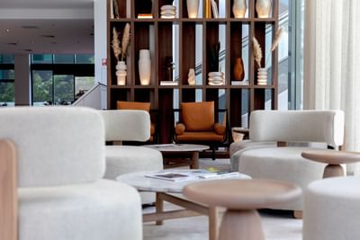 Cozy seating arranged in the lobby area at Amora Hotel Brisbane