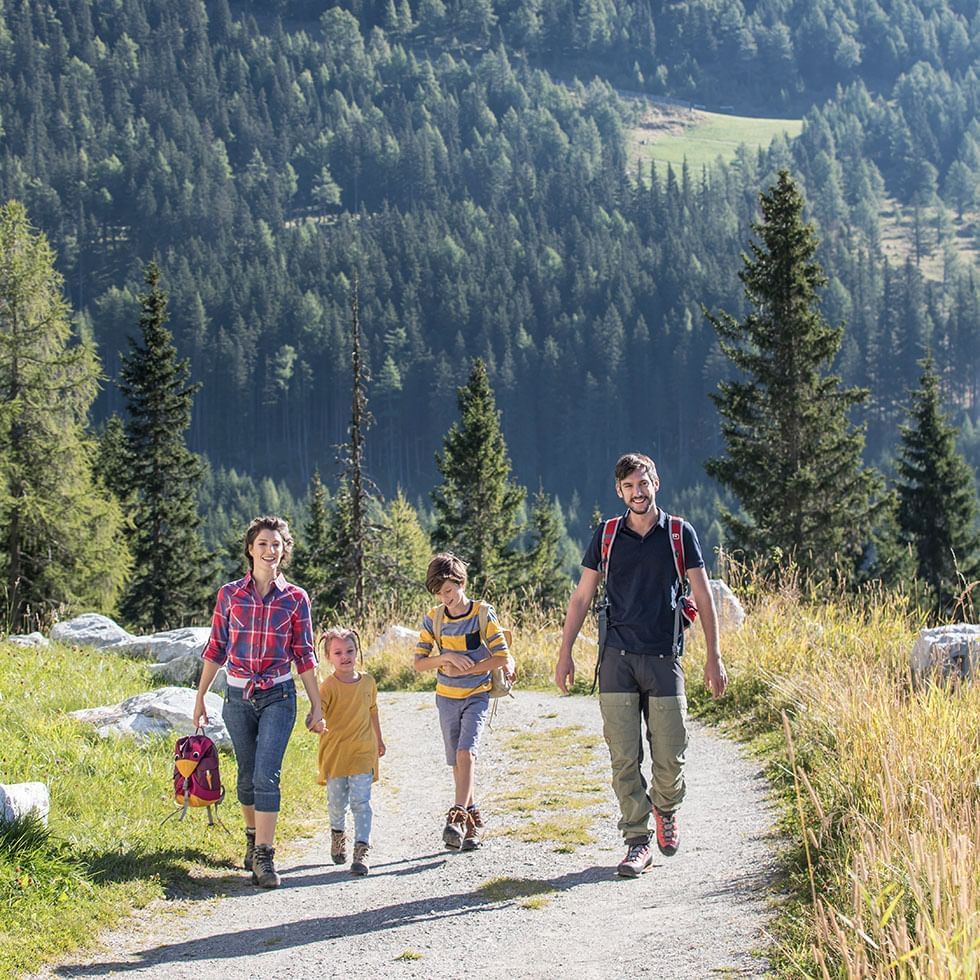 A family walking on a footpath near Falkensteiner Hotels