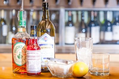 Bar with liquor and glasses to make cocktails at Alpenhof Lodge