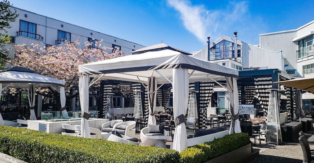 The dockside patio view of cabana at Granville Island Hotel
