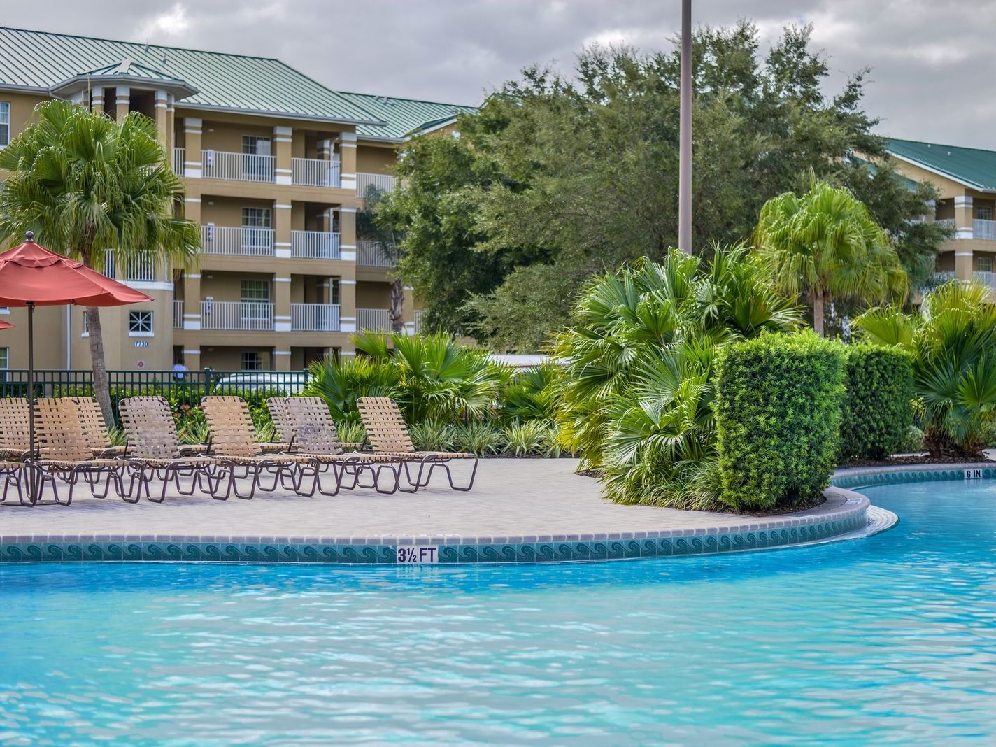 The pool area with pool chairs at Mystic Dunes Resort