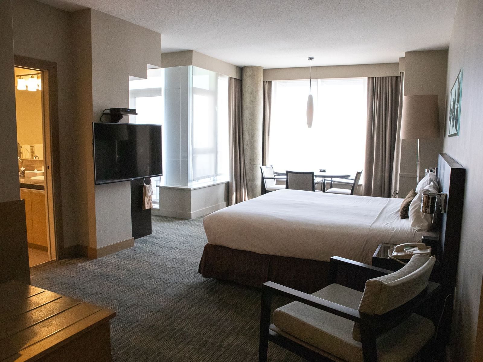 a bed facing a tv in a hotel room