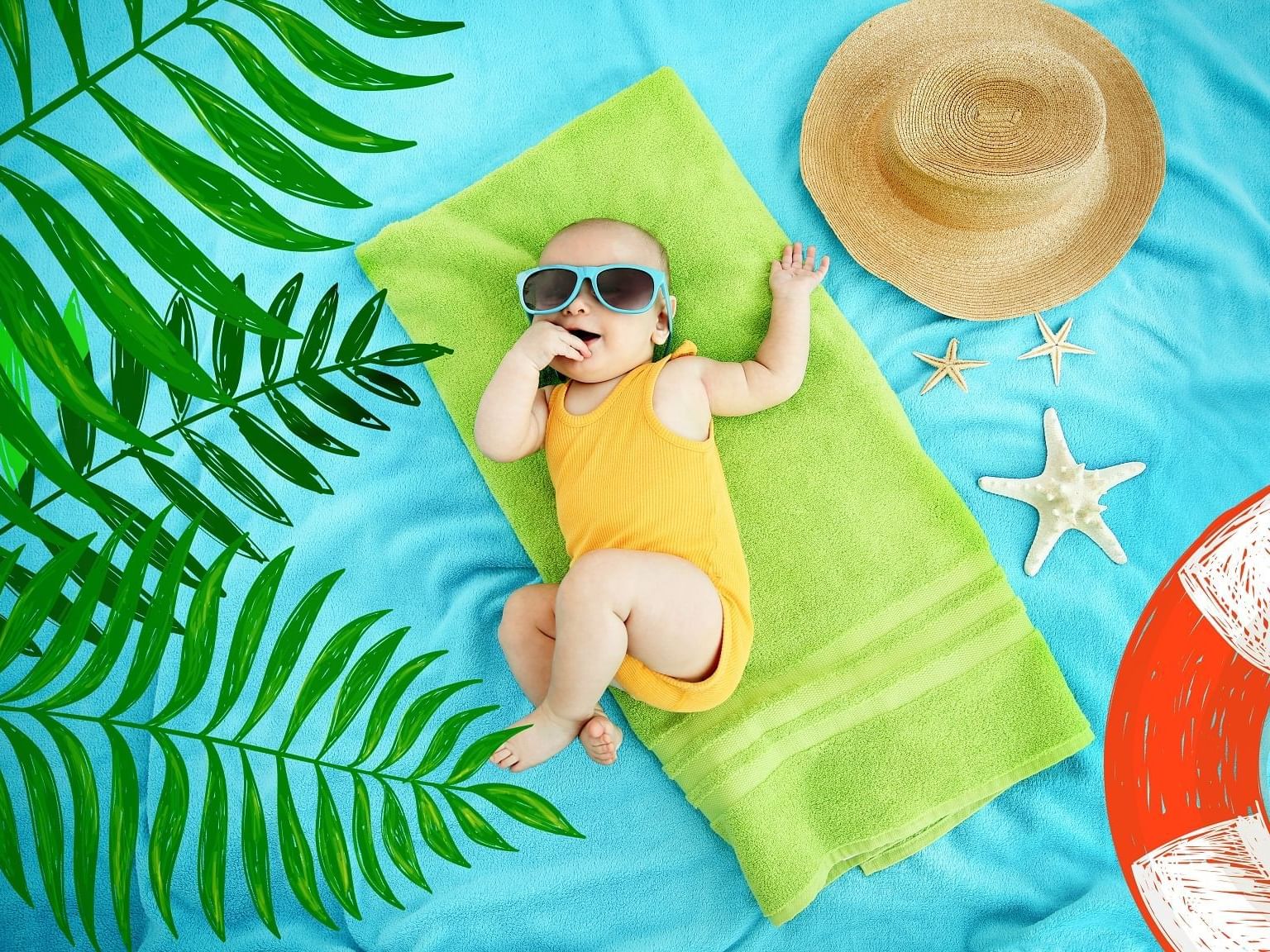 Baby lying on fabric background at Daydream Island Resort