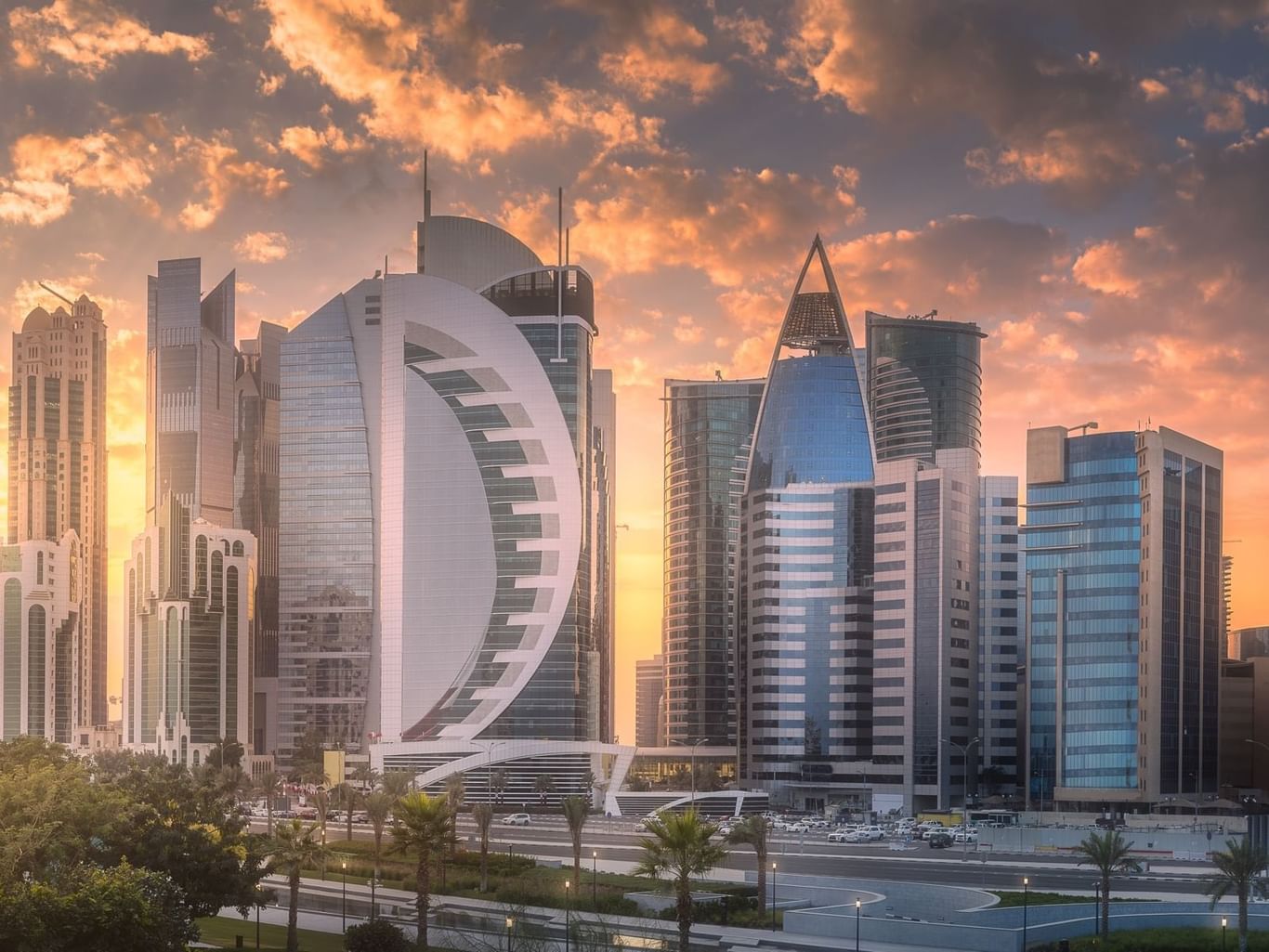 Modern skyline with towering buildings and palm trees near Warwick Corporate