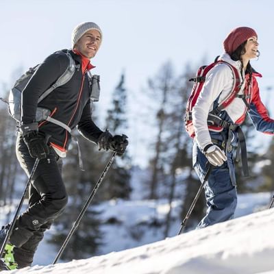 A couple while ski touring near Falkensteiner Hotels