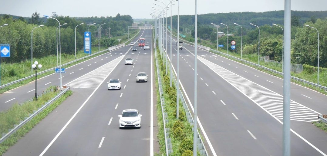 Multi-lane highway with cars & street lamps near Sunway Hotel Hanoi