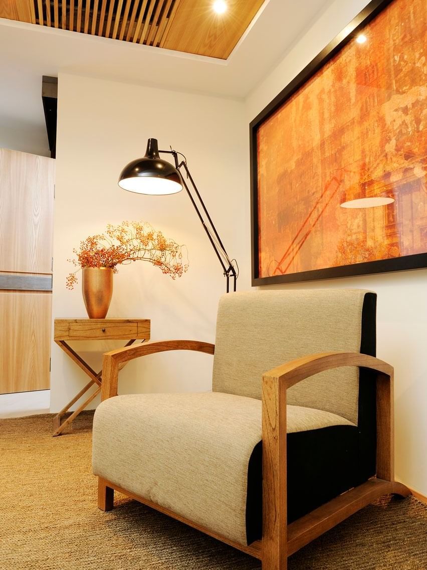Deluxe Room with cozy chair and lamp in the living area at Babuino 181