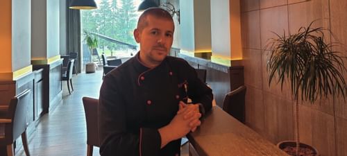 A chef posing at Ana Hotels in Romania