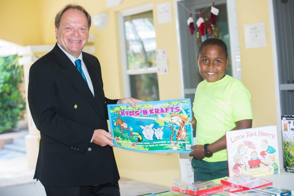A man, a child posing for a picture, The Somerset On Grace Bay