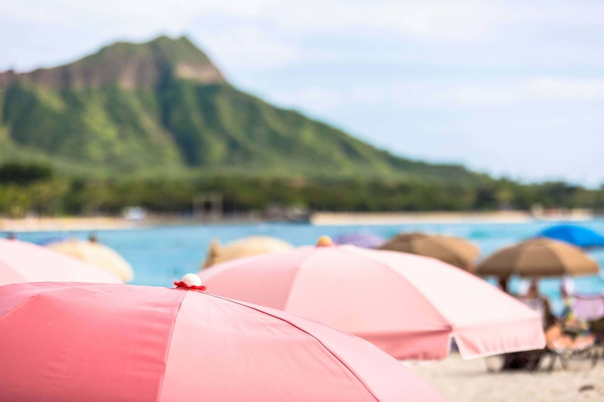 Close-up of sun huts on the beach near Waikiki Resort Hotel