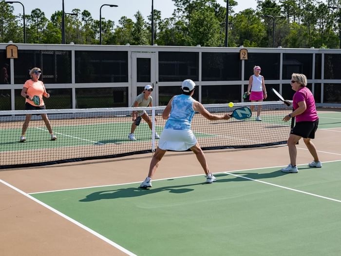 Camp Creek Inn guests enjoying a doubles pickleball game