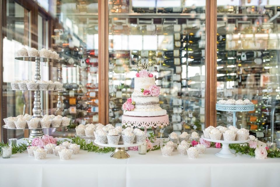 Wedding cake & cupcakes on a table at our Avalon wedding venue