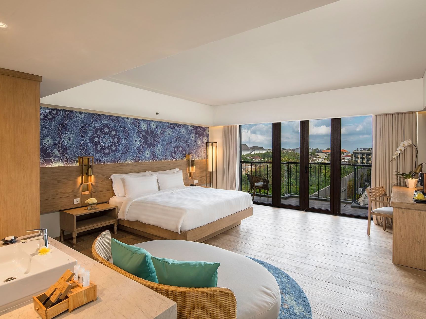 Comfy bed & city view from the Executive Room at Eastin Ashta Resort Canggu