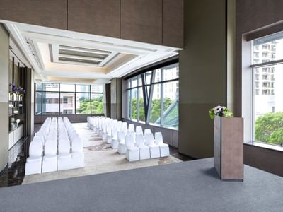 A meeting room with a chairs arranged at Okura Prestige Bangkok