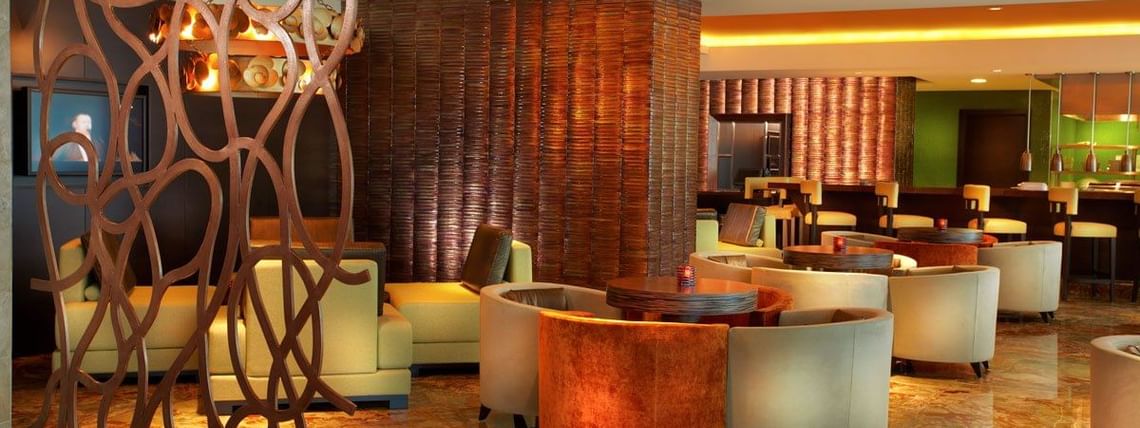 Ciao with elegant seating with wooden tables at Megapolis Hotel Panama