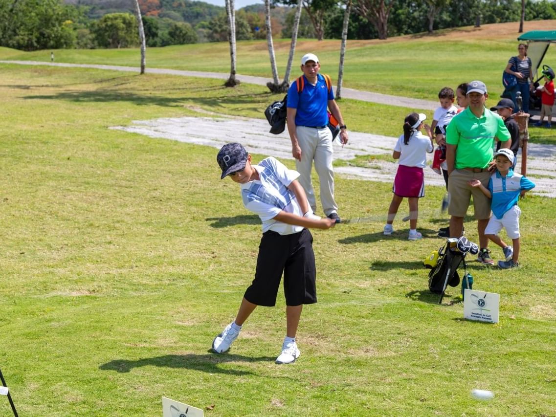 Kid Playing Golf
