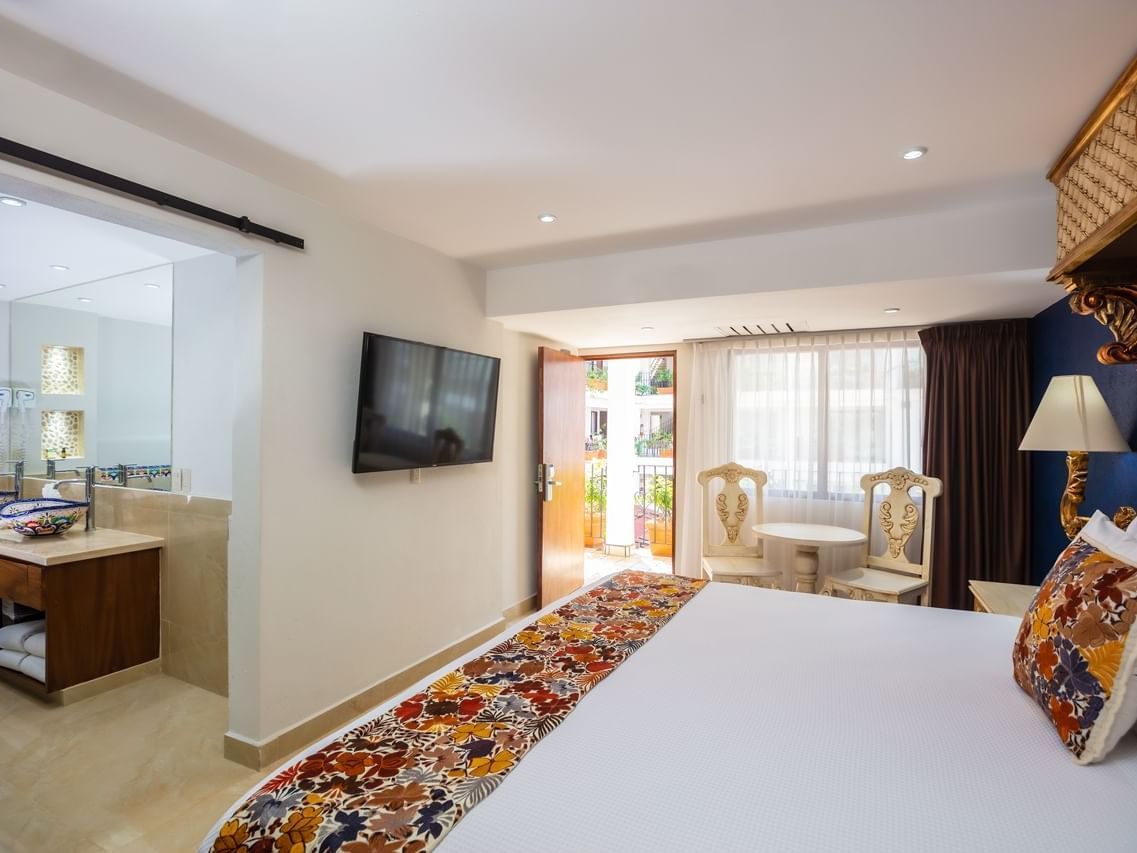 Double bed & a TV in Standard Premium Room at Playa Los Arcos