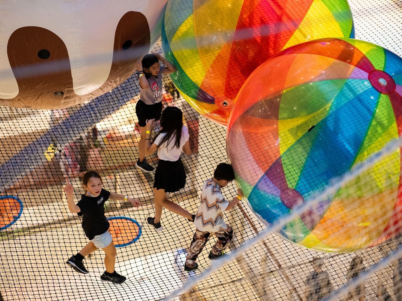 Children playing with inflatable Balls at One Farrer Hotel