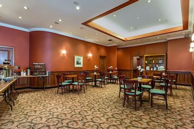 Dining table arranged in the Restaurant at Chelsea Savoy Hotel.