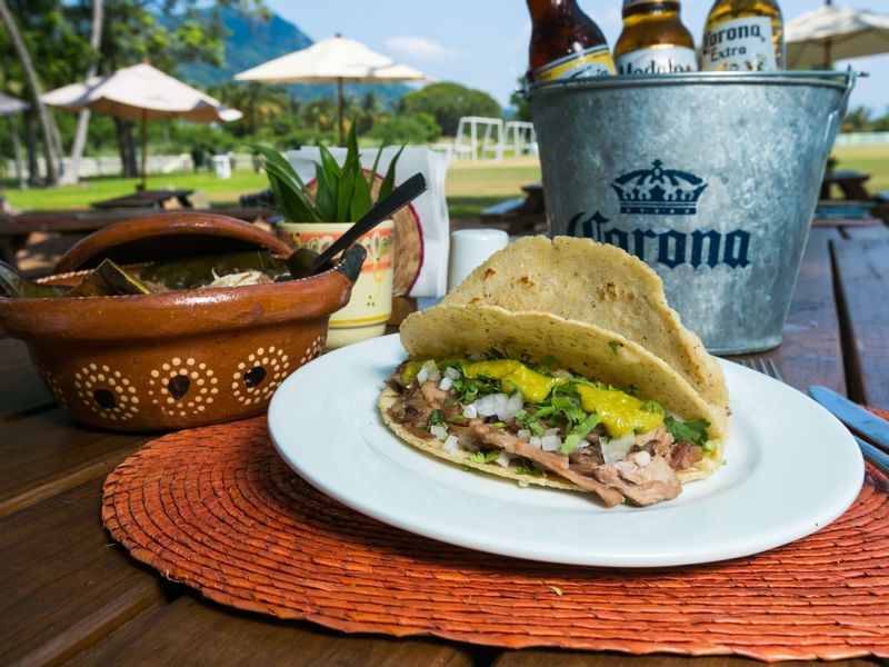 Tacos & beers serve at La Parota Familiar in Mundo Imperial