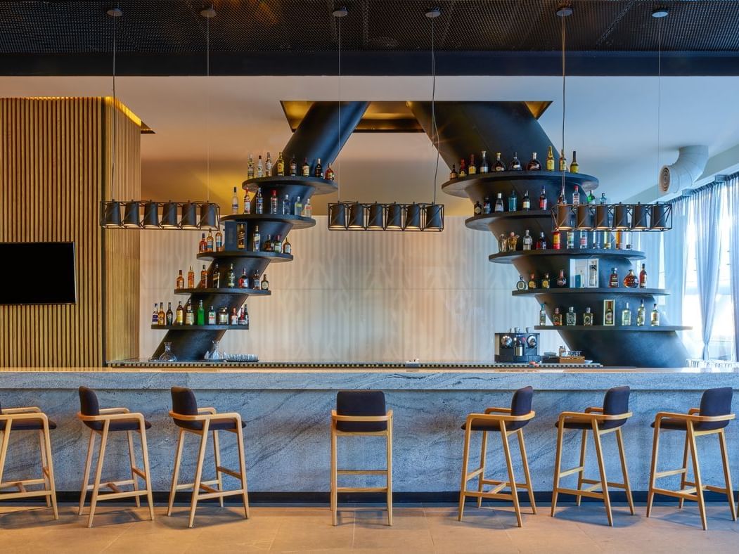 Bar counter with liquor display in Serrano Bar at La Colección