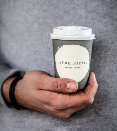 A paper coffee cup at Urban Pantry Manuka at Knightsbridge
