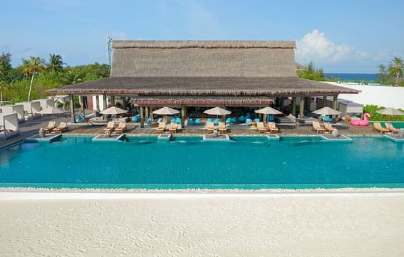 Breeze Poolside Dining & Bar with thatched roof at Grand Park Kodhipparu, Maldives