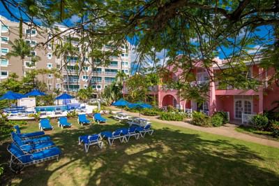 Exterior view of Flowers building from East with pool and garden at Dover Beach Hotel